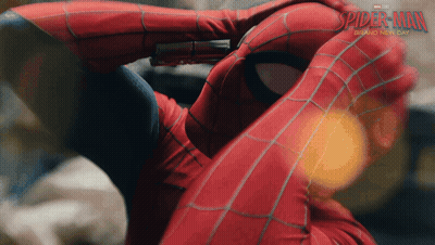 A Close Up Of A Person In A Spiderman Costume GIF