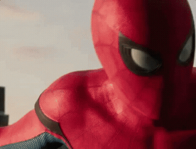 A Close Up Of A Person In A Spiderman Costume Looking At The Camera . GIF