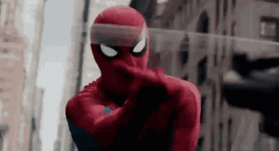 A Close Up Of A Person In A Spiderman Costume Pointing . GIF