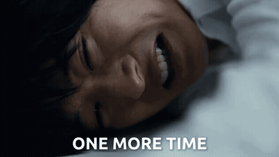 A Close Up Of A Person Laying Down With The Words One More Time Written Below Them GIF