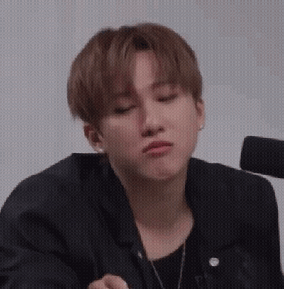 A Close Up Of A Person Making A Face With Their Mouth Open . GIF