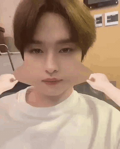 A Close Up Of A Person Making A Funny Face With Their Mouth Open . GIF