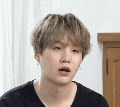 A Close Up Of A Person Making A Funny Face With Their Mouth Open . GIF
