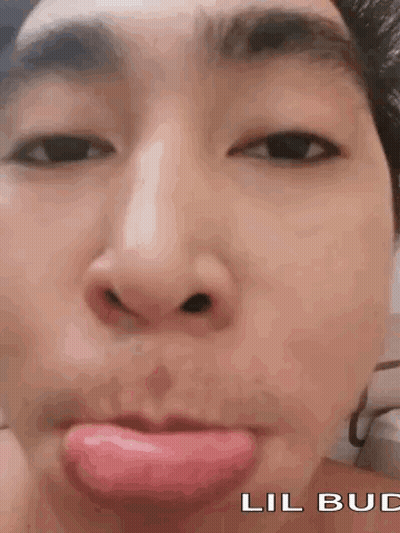 A Close Up Of A Person Making A Funny Face With Their Tongue Out . GIF
