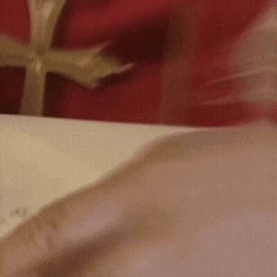A Close Up Of A Person Opening A Gift Box GIF