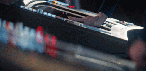 A Close Up Of A Person Playing A Piano GIF