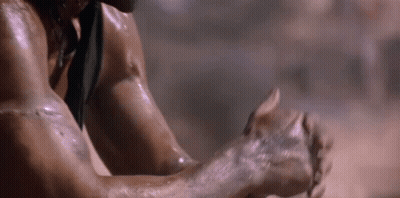 A Close Up Of A Person 'S Arm With A Knife In It . GIF