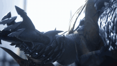 A Close Up Of A Person 'S Arm With Sharp Claws And Feathers GIF