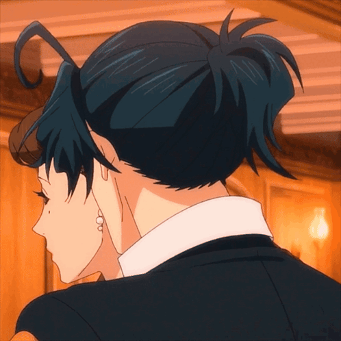 A Close Up Of A Person 'S Back With A Bun GIF
