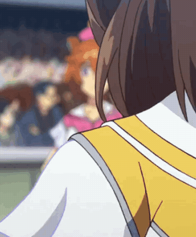 A Close Up Of A Person 'S Back With A Yellow Vest GIF