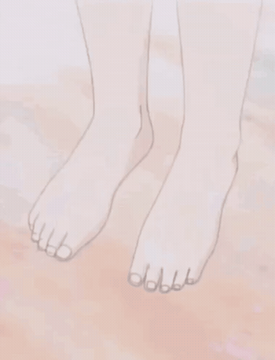 A Close Up Of A Person 'S Bare Feet On A Sandy Surface . GIF