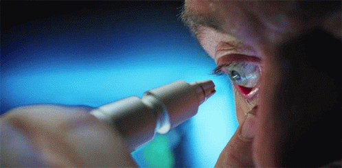 A Close Up Of A Person 'S Eye Being Examined With A Microscope GIF
