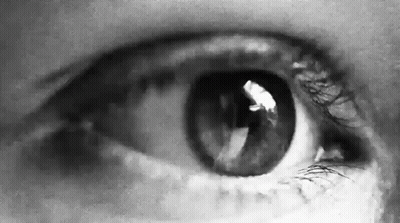 A Close Up Of A Person 'S Eye In A Black And White Photo GIF