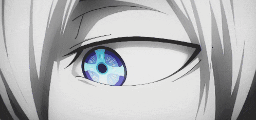 A Close Up Of A Person 'S Eye With A Cross In The Center GIF