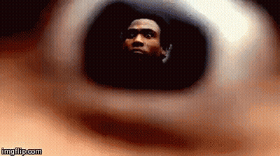 A Close Up Of A Person 'S Eye With A Man 'S Face Visible GIF