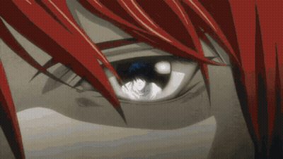 A Close Up Of A Person 'S Eye With Red Hair And A Blue Eye GIF