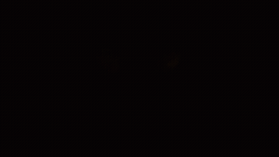 A Close Up Of A Person 'S Eyes Glowing In The Dark GIF