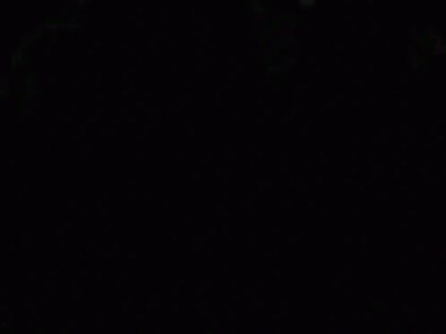 A Close Up Of A Person 'S Eyes In The Dark GIF