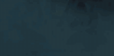 A Close Up Of A Person 'S Eyes In The Dark With A Light Coming Out Of Them . GIF