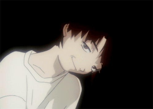 A Close Up Of A Person 'S Face In A Dark Room GIF