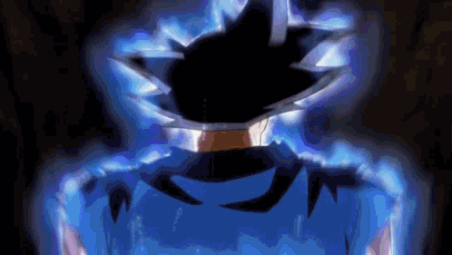 A Close Up Of A Person 'S Face In A Dark Room With A Blue Background . GIF