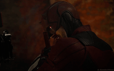A Close Up Of A Person 'S Face In A Dark Room With A Blurred Background . GIF