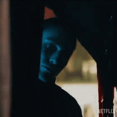 A Close Up Of A Person 'S Face In A Dark Room With Blood On The Floor . GIF