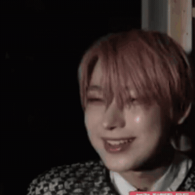 A Close Up Of A Person 'S Face In A Dark Room . GIF