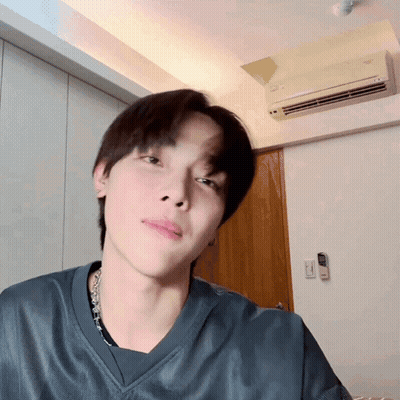 A Close Up Of A Person 'S Face In A Room With An Air Conditioner GIF
