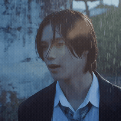 A Close Up Of A Person 'S Face In A Suit And Tie GIF
