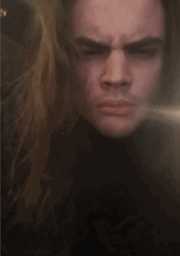 A Close Up Of A Person 'S Face Making A Silly Face GIF