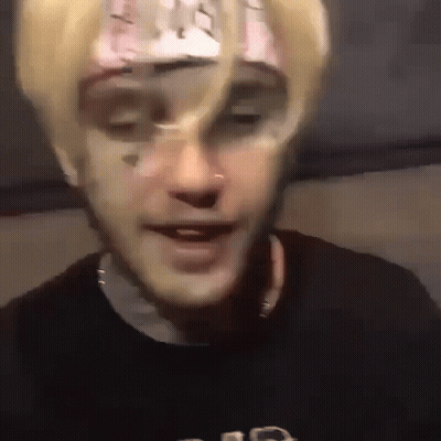 A Close Up Of A Person 'S Face With A Bandana On It . GIF
