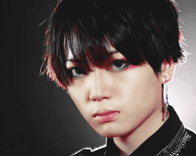 A Close Up Of A Person 'S Face With A Black Background And The Letters Aa And Ea On The Bottom GIF