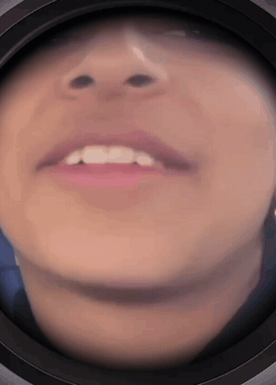 A Close Up Of A Person 'S Face With A Black Circle Around It GIF