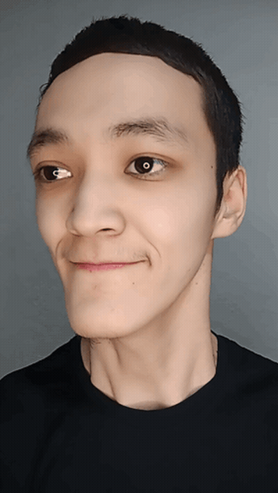 A Close Up Of A Person 'S Face With A Black Shirt GIF