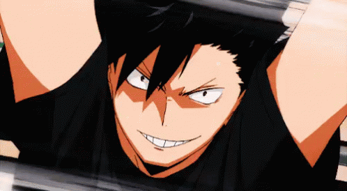 A Close Up Of A Person 'S Face With A Black Shirt On And A Smile On Their Face . GIF