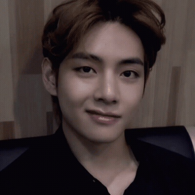 A Close Up Of A Person 'S Face With A Black Shirt On . GIF