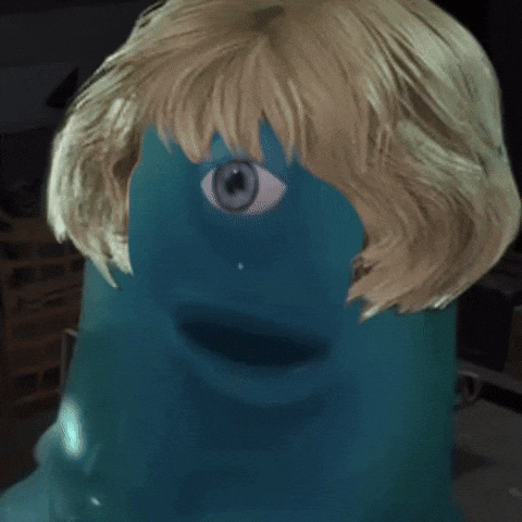 A Close Up Of A Person 'S Face With A Blue Eye And Blonde Hair GIF