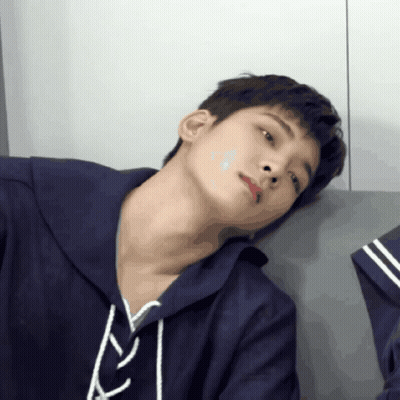 A Close Up Of A Person 'S Face With A Blue Hoodie On GIF