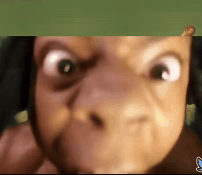 A Close Up Of A Person 'S Face With A Blue S On The Bottom GIF