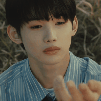 A Close Up Of A Person 'S Face With A Blue Shirt On GIF