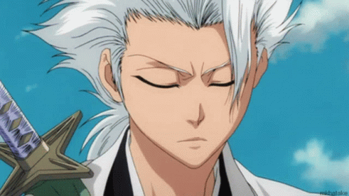A Close Up Of A Person 'S Face With A Blue Sky In The Background And The Name Michatake On The Bottom GIF