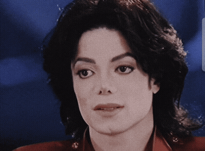 A Close Up Of A Person 'S Face With A Blurred Background GIF