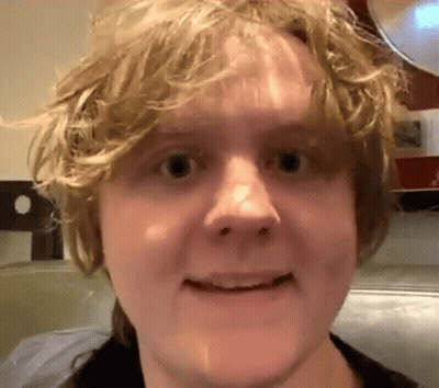 A Close Up Of A Person 'S Face With A Blurred Background GIF