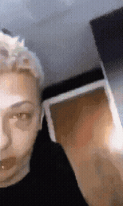 A Close Up Of A Person 'S Face With A Blurry Background GIF