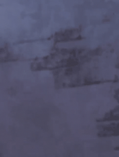 A Close Up Of A Person 'S Face With A Bun In Their Hair GIF