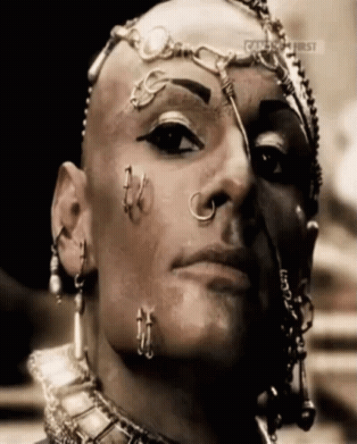 A Close Up Of A Person 'S Face With A Caption That Says ' Celebrity First ' GIF