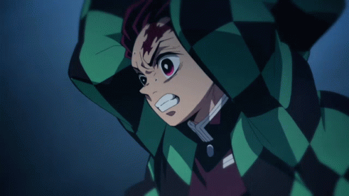 A Close Up Of A Person 'S Face With A Checkered Jacket On GIF