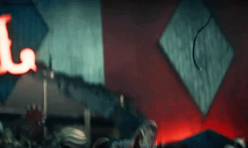 A Close Up Of A Person 'S Face With A Crown On Their Head In A Room . GIF