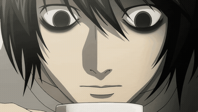 A Close Up Of A Person 'S Face With A Cup In Front Of Them GIF